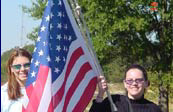 Women holding the Flag